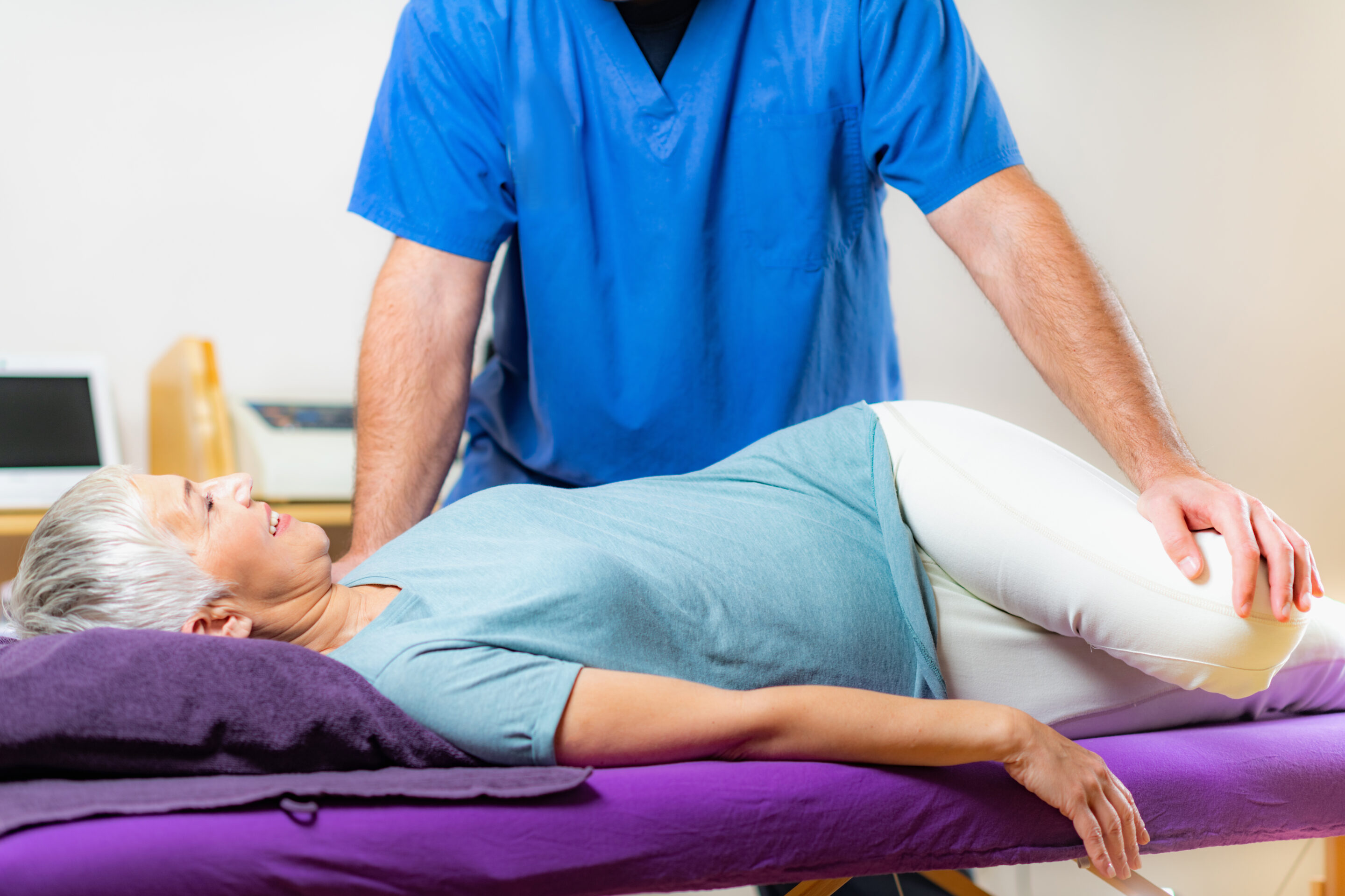 Specialist pelvic health physiotherapist assessing a patient in a central London clinic