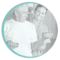 Physiotherapist supporting an older adult with strength exercises for arthritis