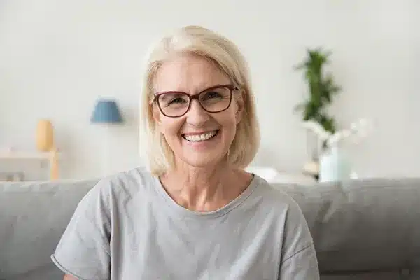 Smiling woman at home representing personalised menopause physiotherapy support