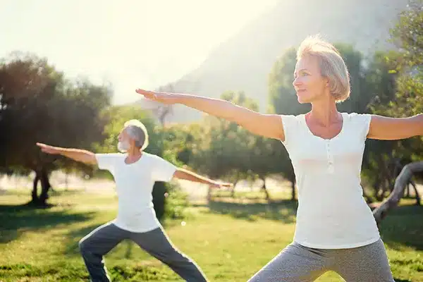 Women exercising outdoors during menopause to support strength and balance